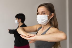 women exercising with face masks